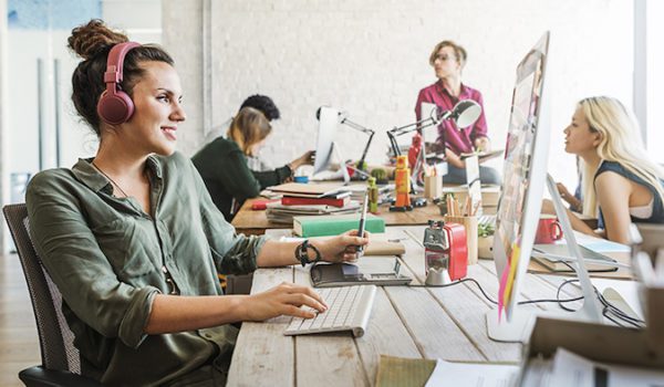 People sitting in an open office type setting