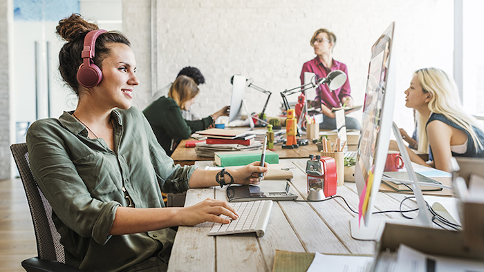 People sitting in an open office type setting