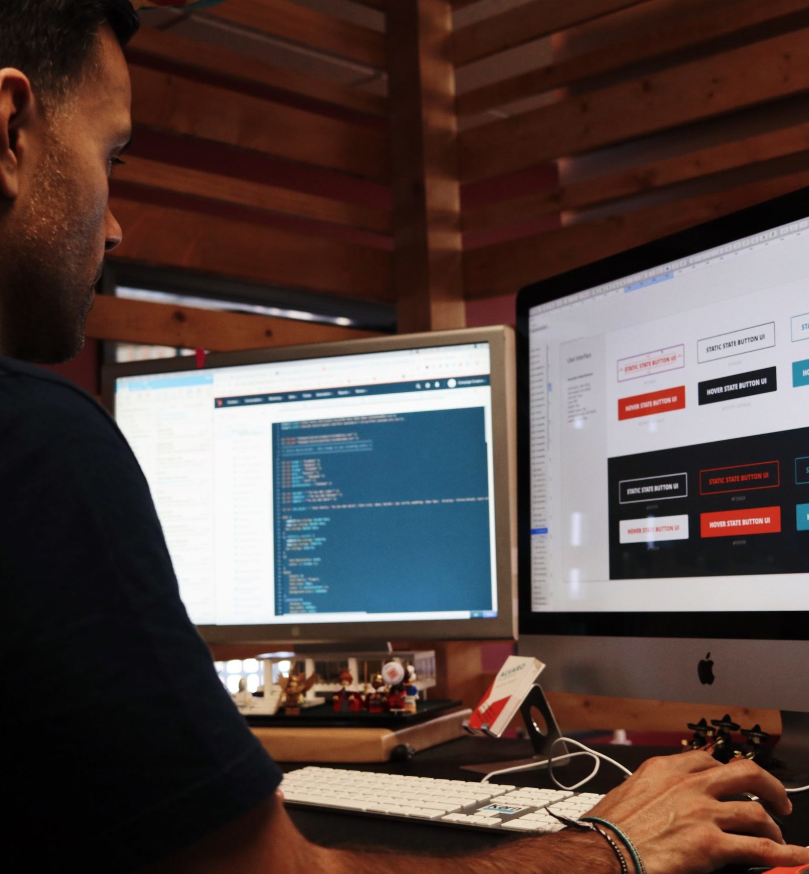 man using two computer monitors to work