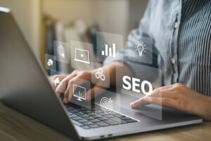 A personal injury lawyer using a laptop with icons representing SEO and digital marketing concepts floating above the keyboard.